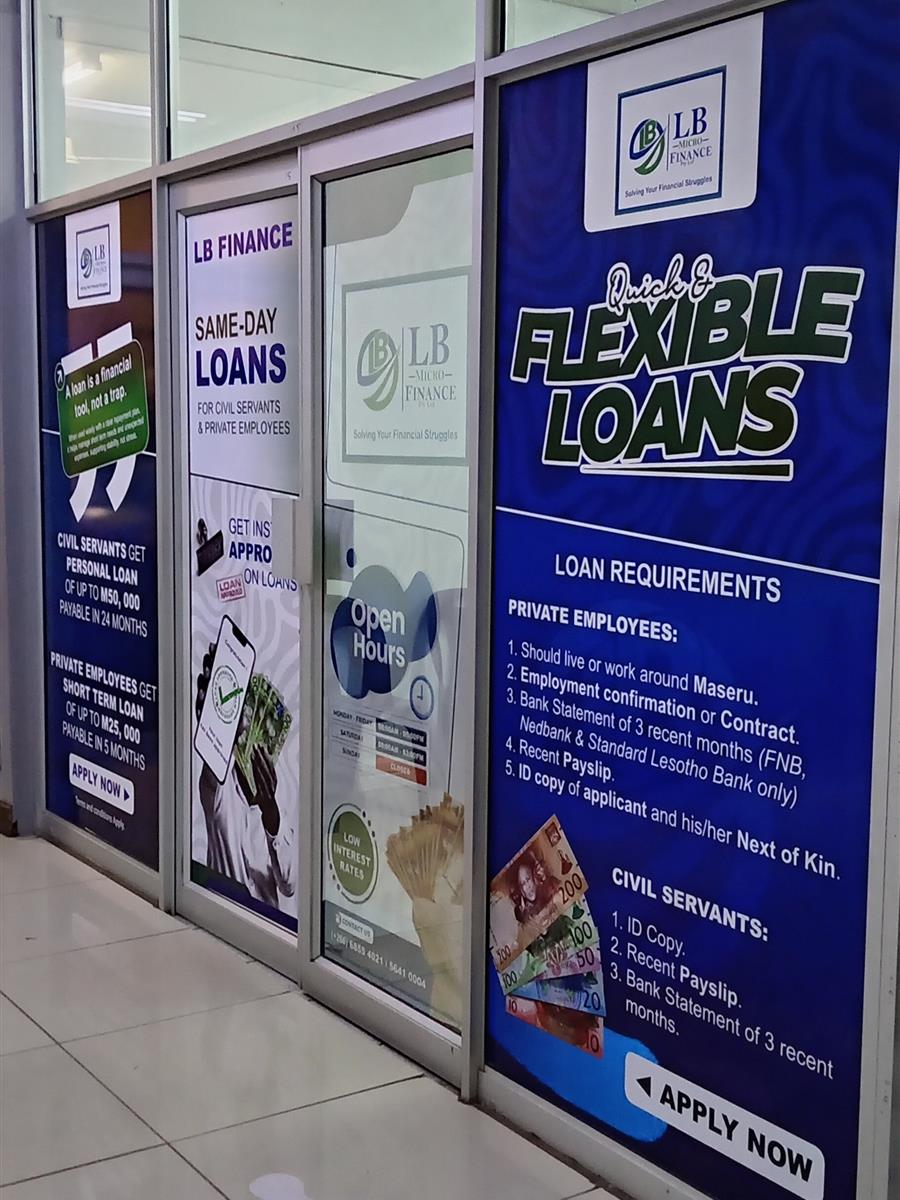 LB Microfinance office windows with loan information